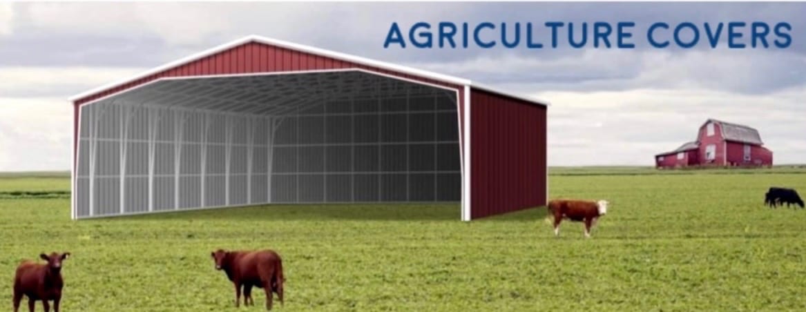 Red open sided agriculture cover standing in a cattle pasture, with the words agriculture covers printed across the sky